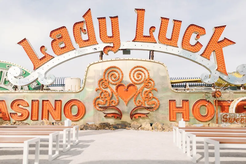 The Lady Luck sign standing above the boneyard with its heart and scrollwork