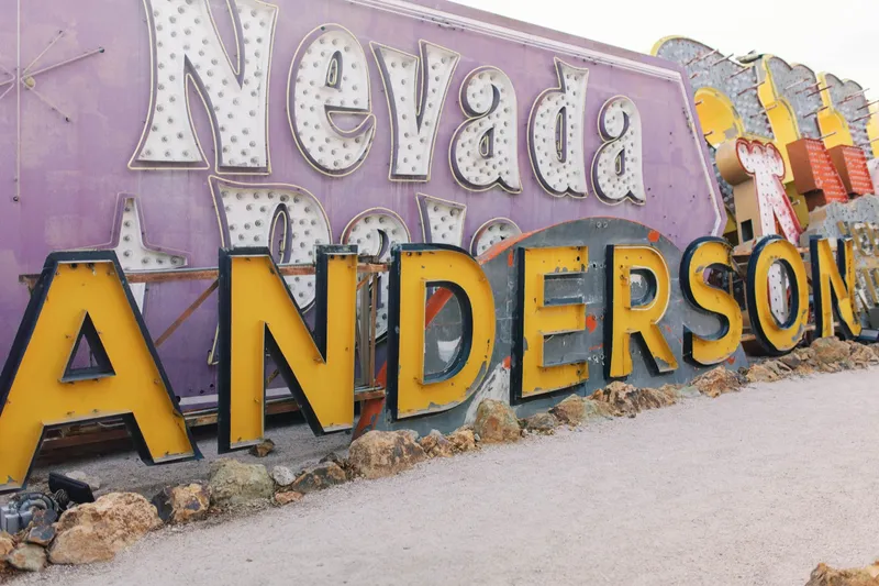 The Nevada and Landers signs propped side by side in the gravel