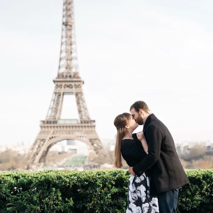 McKenzie and her husband Ben in front of the Eiffel Tower in Paris