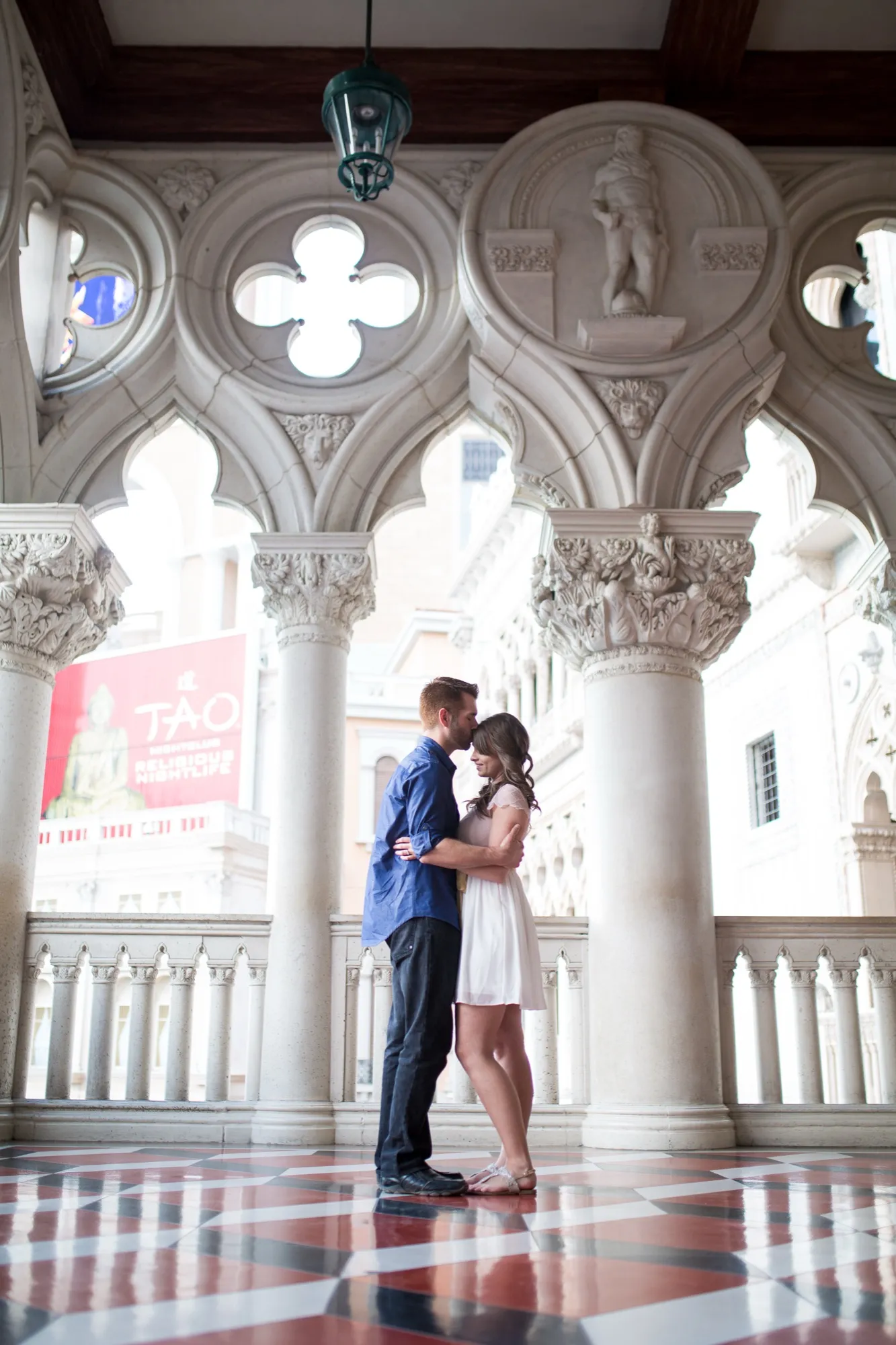 Couple kissing under the arches at The Venetian on the Las Vegas Strip