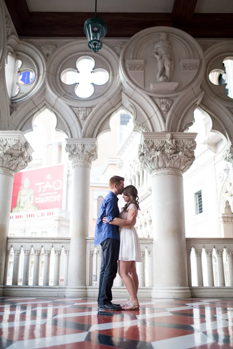 Bride and groom kissing under the arches at The Venetian in Las Vegas