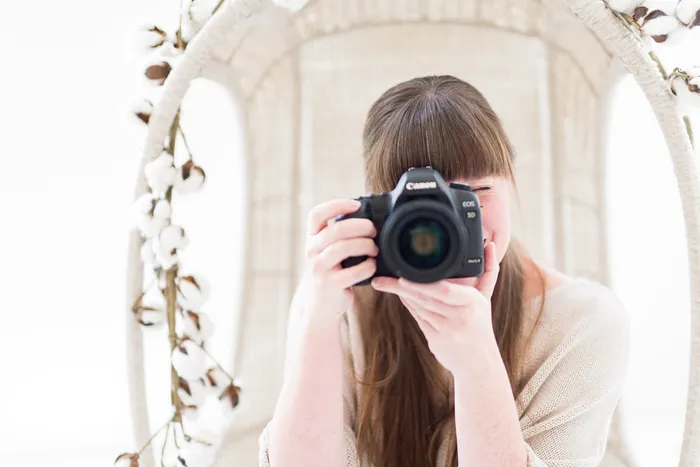McKenzie Stewart photographing with her camera raised