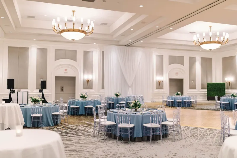 Second view of the ballroom before guests arrive, tables set and the head table along the far wall