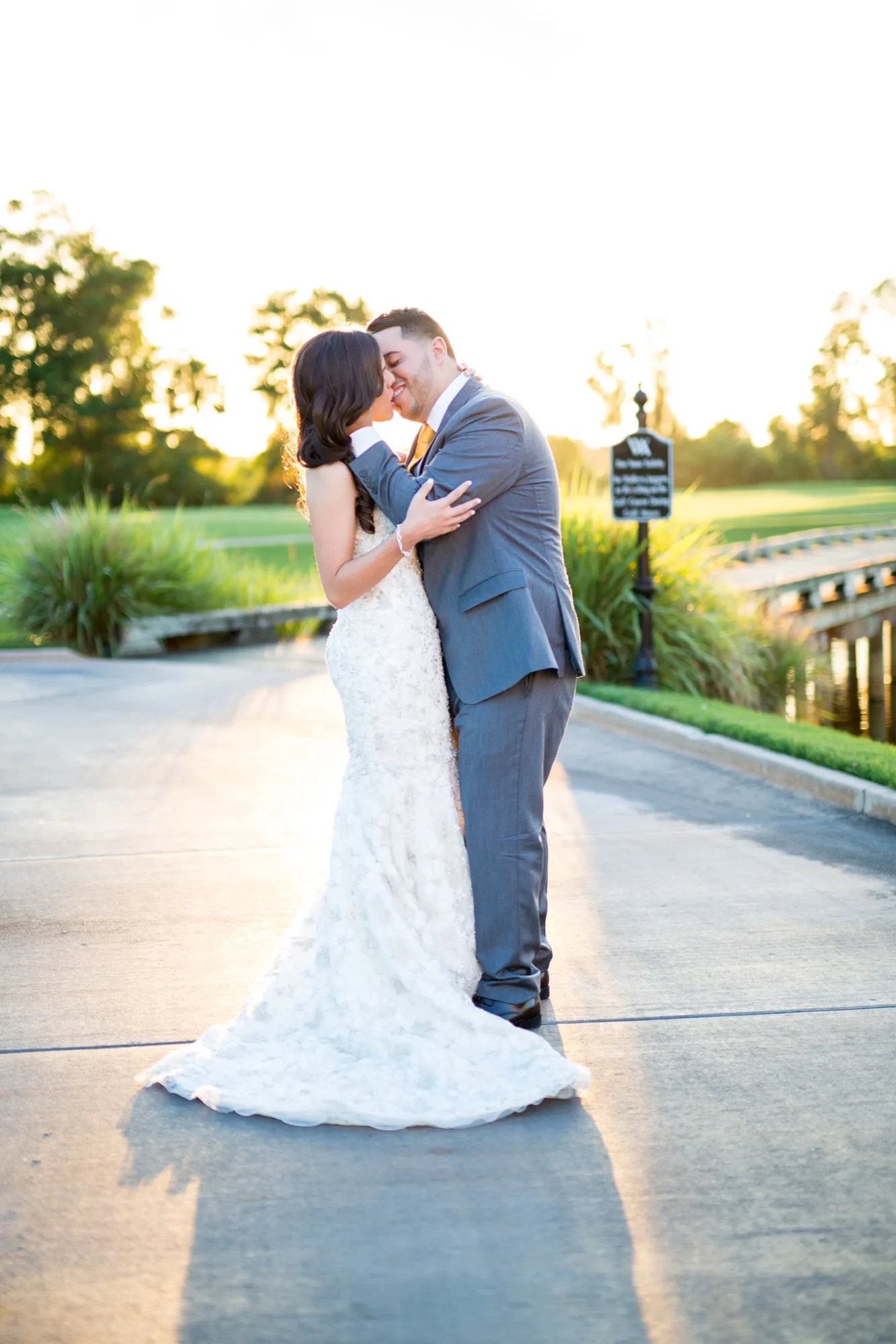 A bride and groom in golden sunset light on a Las Vegas golf course